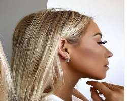 She has a total of four piercing in her ears.